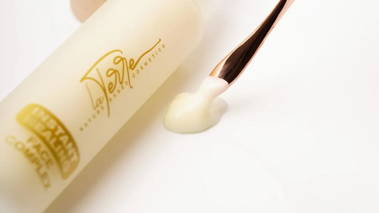 Close-up of an Aveeno moisturizer bottle with a dab of cream on a white surface, illustrating the quick snapshot comparison.