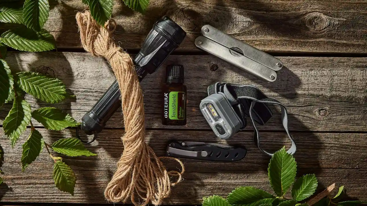Natural workspace with green leaves, a coiled rope, and blending tools on a wooden surface, suggesting the careful process of selecting carrier oils for sensitive skin