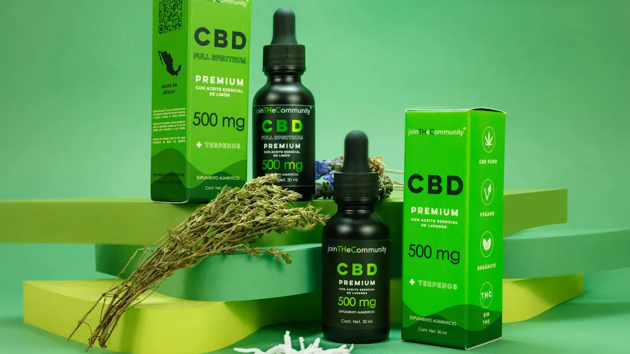 CBD hemp oil products (bottles and boxes) displayed on a green background, illustrating hemp-derived supplements.
