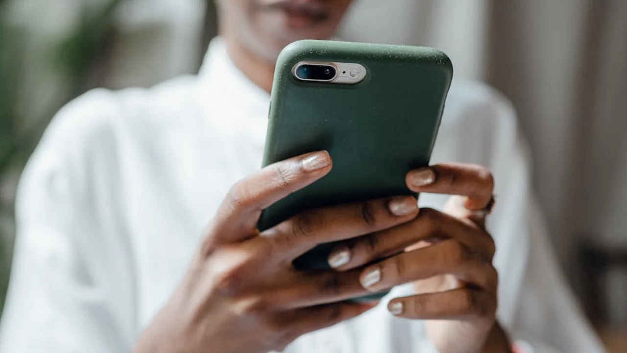 Person holding a smartphone and shopping online