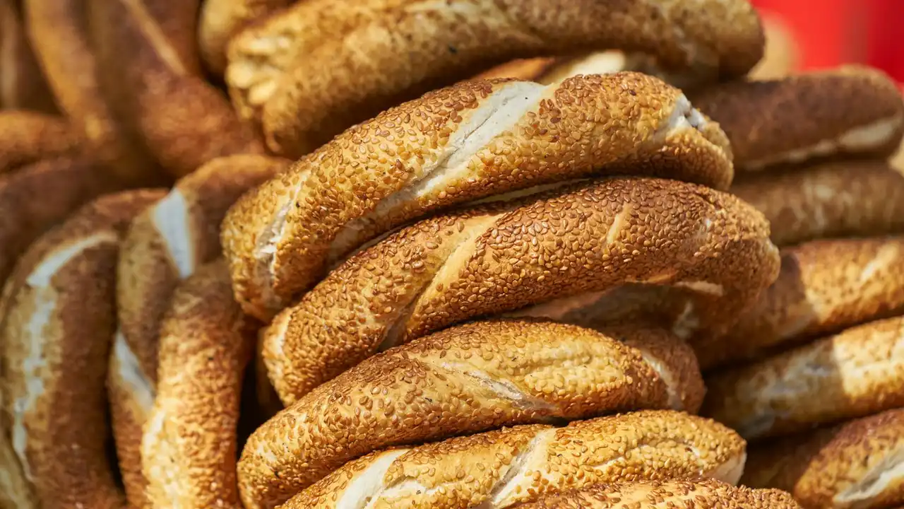 Close-up of sesame-seed coated ring-shaped bread stacked together