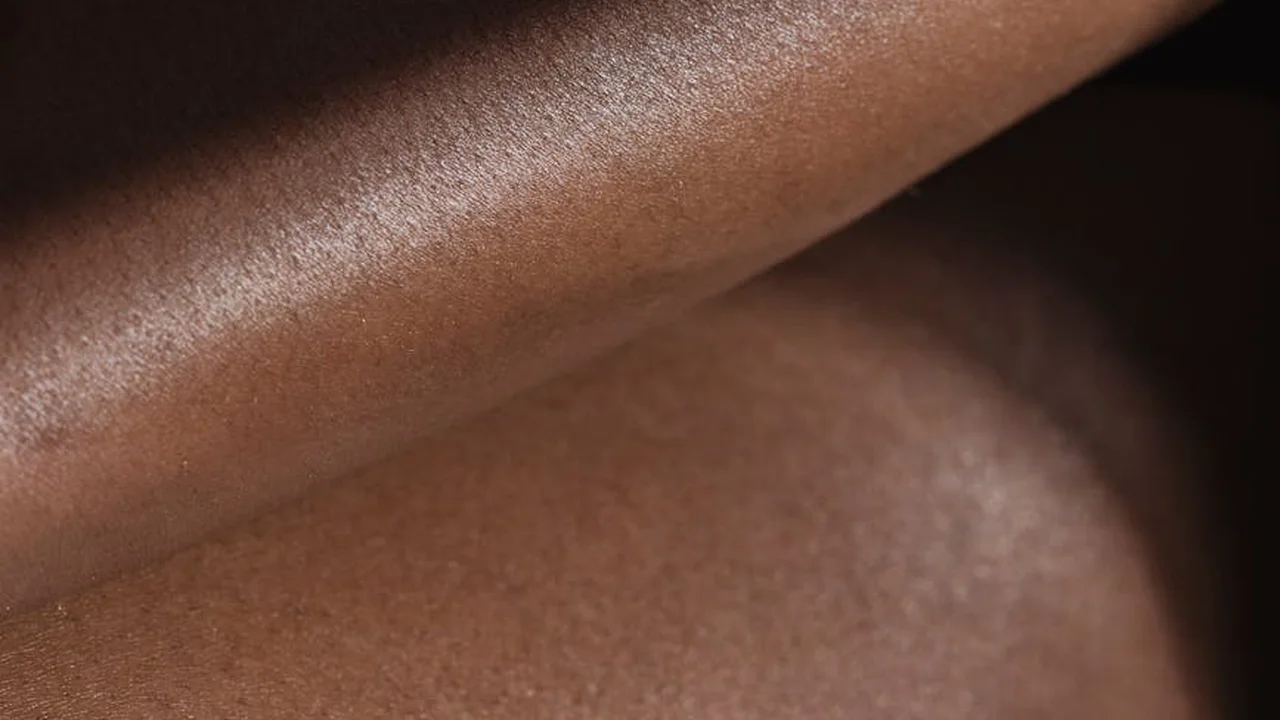 Close-up of skin with smooth, hydrated texture and natural sheen.
